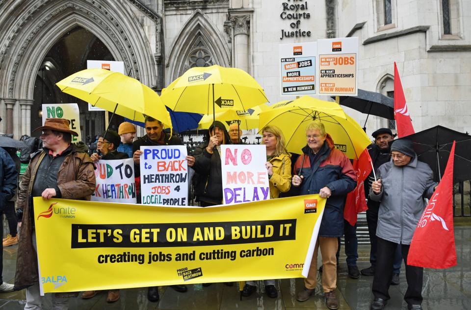 Campaigners outside the Royal Courts of Justice in London where a Court of Appeal ruling is taking place on the Heathrow expansion row. (PA)