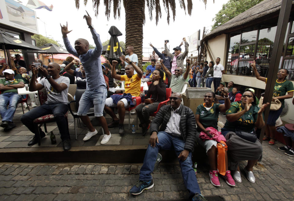 South African fans celebrate at Vilakazi street in Soweto, South Africa, after their team's victory in the Rugby World Cup final between South Africa and England being played in Tokyo, Japan from Saturday Nov. 2, 2019. South Africa defeated England 32-12. (AP Photo/Themba Hadebe)