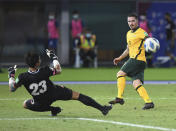 Australia's Jamie Maclaren shoots by Chinese Taipei's goalkeeper Shih Shin-An during the World Cup 2022 Group B qualifying soccer match between Chinese Taipei and Australia in Kuwait City, Kuwait, Monday, June 7, 2021. (AP Photo/Jaber Abdulkhaleg)