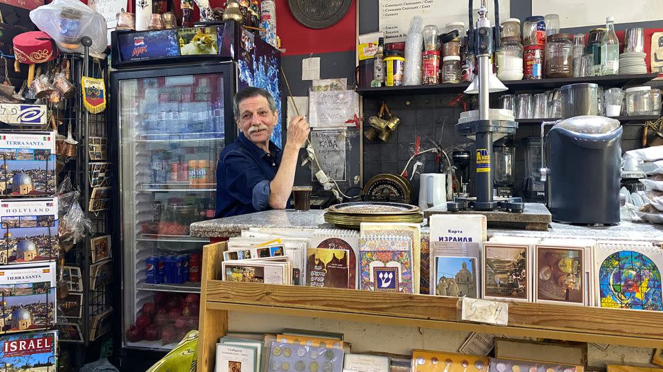 Abu Nader was born in the Old City of Jerusalem. He has spent his whole life in the city. Pictured in his coffee shop in the Muslim Quarter.  - Ivana Kottasova/CNN