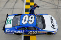 DOVER, DE - OCTOBER 01: Carl Edwards, driver of the #60 Fastenal Ford, celebrates in front of the fans after he won the NASCAR Nationwide Series OneMain Financial 200 at Dover International Speedway on October 1, 2011 in Dover, Delaware. (Photo by Jason Smith/Getty Images for NASCAR)