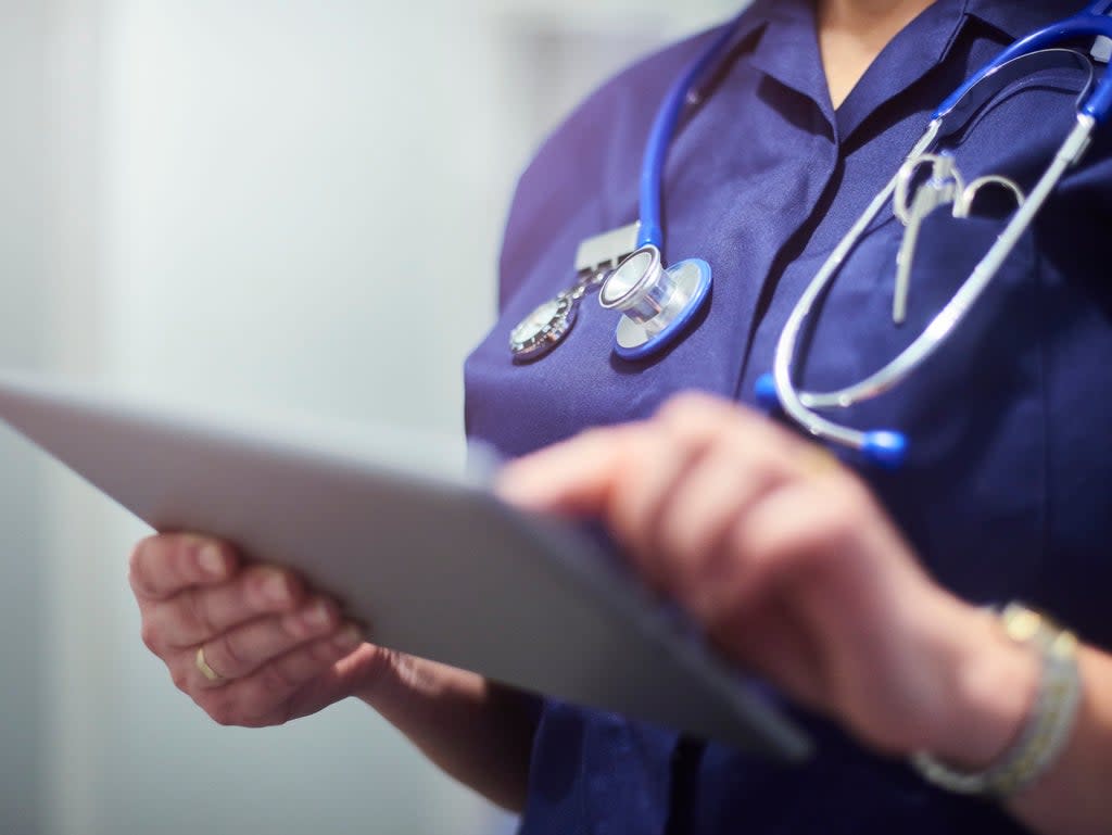 Female nurse using a digital tablet (Getty Images)