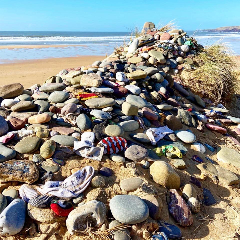 Harry Potter fans leave tributes including old socks to Dobby at Freshwater West Beach in Pemrokshire, Wales. (lamshootspics)