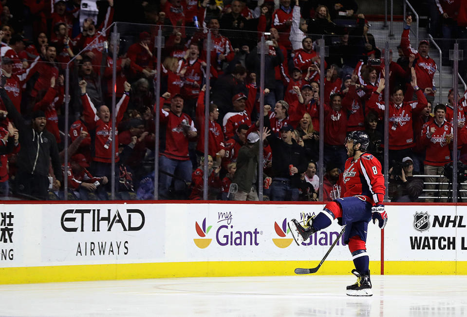 <p>Alex Ovechkin celebrates after scoring a goal for his 1,000th career point against the Pittsburgh Penguins in the first period at Verizon Center on January 11, 2017, in Washington, DC. (Getty Images) </p>