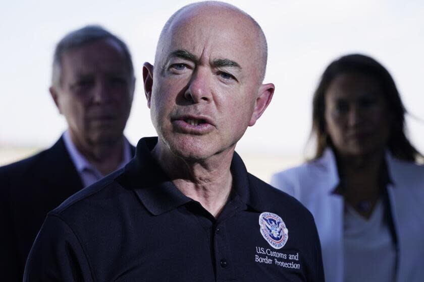 Homeland Security Secretary Alejandro Mayorkas talks to the media, Friday, June 25, 2021, after he and Vice President Kamala Harris toured of the U.S. Customs and Border Protection Central Processing Center in El Paso, Texas. Harris visited the U.S. southern border as part of her role leading the Biden administration's response to a steep increase in migration. (AP Photo/Jacquelyn Martin)