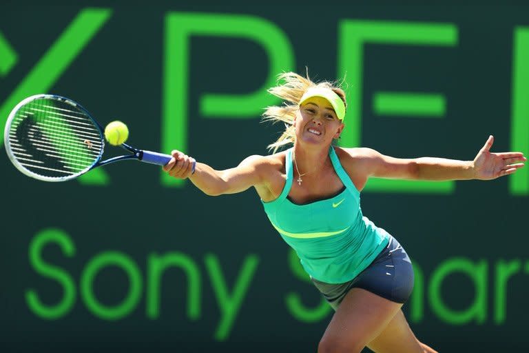 Maria Sharapova returns a shot to Serena Williams at the Miami Masters on March 30, 2013. Sharapova said she was relishing defending the French Open title, even though the Russian star still has no title at Miami