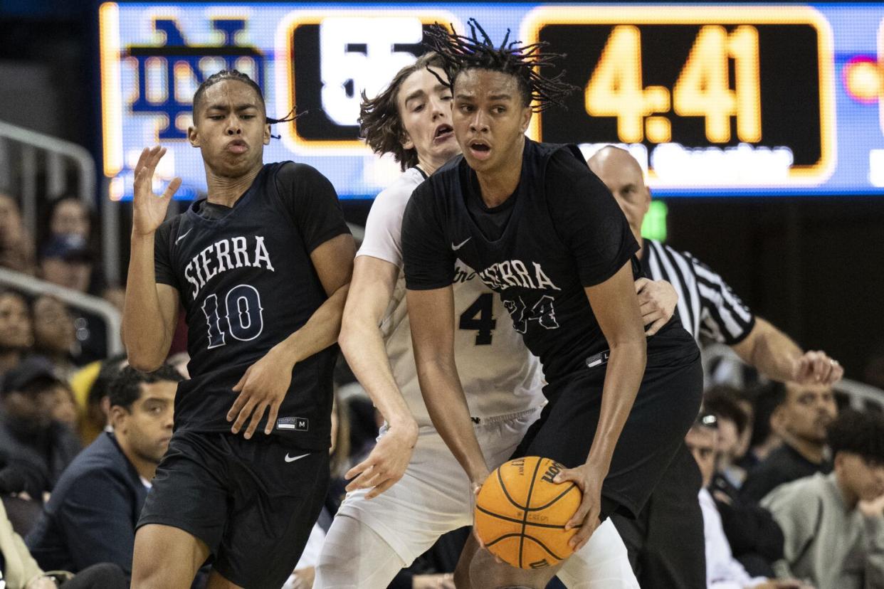 Notre Dame's Dusty Stromer (4) defends Sierra Canyon's Ashton Hardaway (24) on Jan. 27, 2023, at Pauley Pavilion.