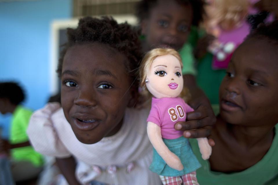 In this Feb. 1, 2014 photo, young orphans play inside the U.S. Church of Bible Understanding-run orphanage in Kenscoff, Haiti. The Church of Bible Understanding lost accreditation to run the orphanage after a series of inspections beginning in late 2012, though the government lacks the resources to shut down homes except in extreme circumstances. (AP Photo/Dieu Nalio Chery)