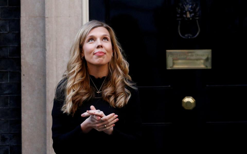 Carrie Symonds outside 10 Downing Street during the Clap for our Carers campaign - Reuters