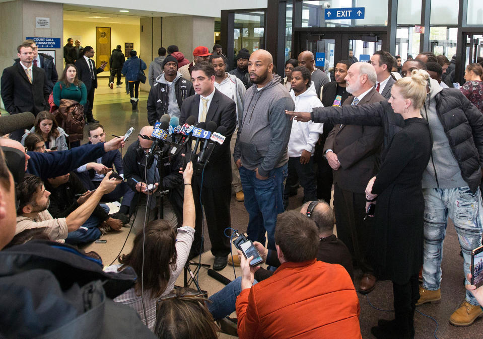 Leonard Gipson (center right), one of 15 convicted men, and Josh Tepfer (center left) speak with reporters on Nov. 16, 2017, after a judge threw out the convictions of Gipson and others who claimed former sergeant Ronald Watts had manufactured evidence that wrongfully sent them to prison.