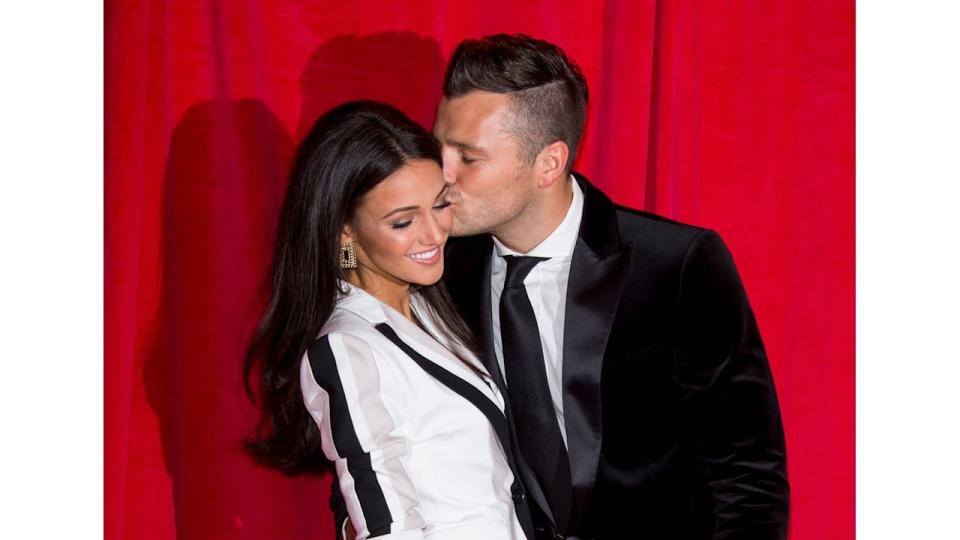  Michelle Keegan and Mark Wright share a kiss at the British Soap Awards 2014