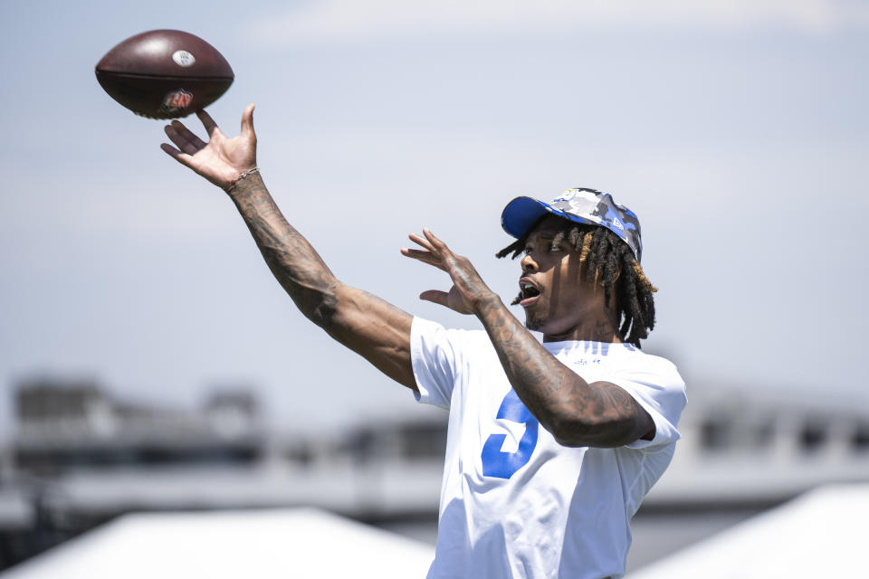 Los Angeles Rams cornerback Jalen Ramsey throws during NFL football practice Monday, July 25, 2022, in Irvine, Calif. (AP Photo/Kyusung Gong)