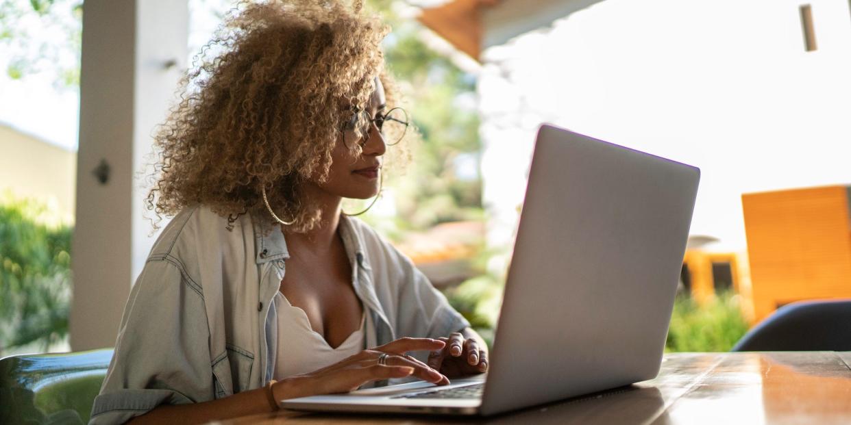 woman typing on laptop