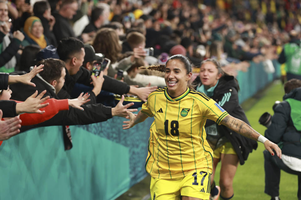 Colombia's Carolina Arias, wearing the jersey of Jamaica's Trudi Carter celebrates at the end of the Women's World Cup round of 16 soccer match between Jamaica and Colombia in Melbourne, Australia, Tuesday, Aug. 8, 2023. (AP Photo/Hamish Blair)