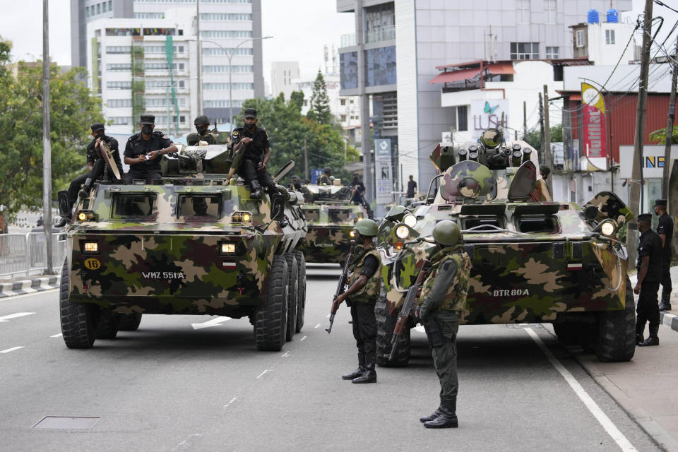 Sri Lankan army soldiers patrol a street in Colombo, Sri Lanka, Saturday, May 14, 2022. Protesters attacked earlier this week by supporters of Sri Lanka’s government are demanding that the newly appointed prime minister arrest his predecessor for allegedly instigating the attack against them as they called for his resignation. (AP Photo/Eranga Jayawardena)