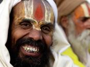 A Sadhu, or Hindu holy man, reacts after an area was allowed to him for setting up his tent for the upcoming "Magh Mela" festival in Allahabad, India, Friday, Dec. 18, 2009. Thousands of people take holy dips at the confluence of the rivers Ganges, Yamuna and the mythical Saraswati during the month-long fair that begins later this month. (AP Photo/Rajesh Kumar Singh)