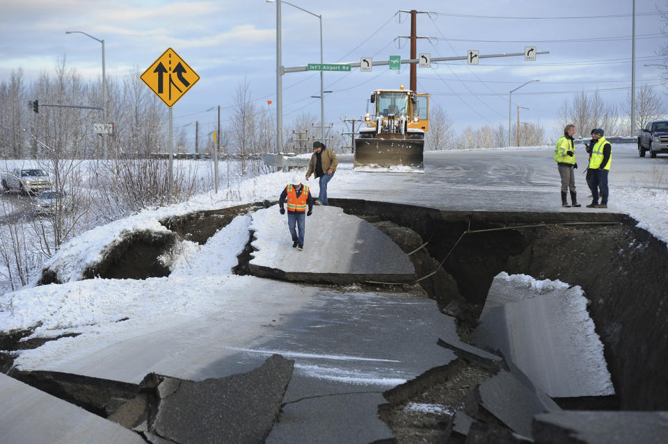 Workers inspect a ramp that collapsed during a morning earthquake, Nov. 30, 2018, in Anchorage, Alaska. (Photo: Mike Dinneen/AP)
