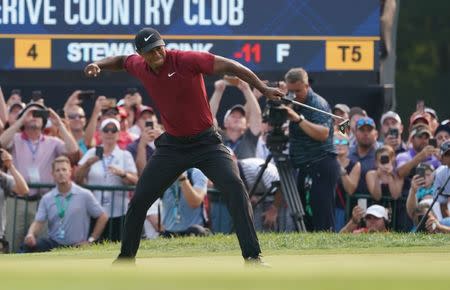 Aug 12, 2018; Saint Louis, MO, USA; Tiger Woods celebrates after making a birdie putt on the 18th green during the final round of the PGA Championship golf tournament at Bellerive Country Club. Jerry Lai-USA TODAY Sports