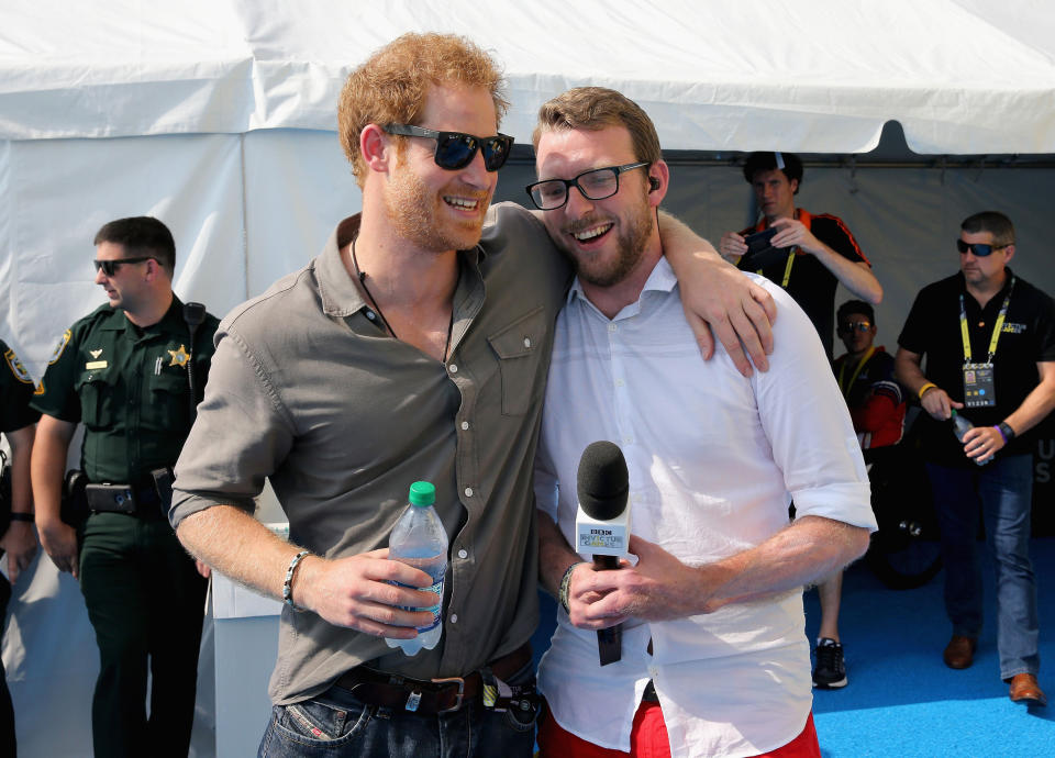 Prince Harry (left) chats with former competitor and now commentator JJ Chalmers outside the competitor's tent at the swimming pool during the Invictus Games 2016 at ESPN Wide World of Sports in Orlando, Florida.