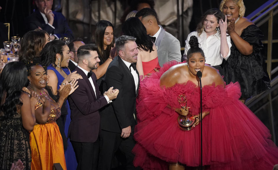 Lizzo and the team from "Lizzo's Watch Out For The Big Grrrls" accept the Emmy for outstanding competition program for "Lizzo's Watch Out For The Big Grrrls" at the 74th Primetime Emmy Awards on Monday, Sept. 12, 2022, at the Microsoft Theater in Los Angeles. (AP Photo/Mark Terrill)