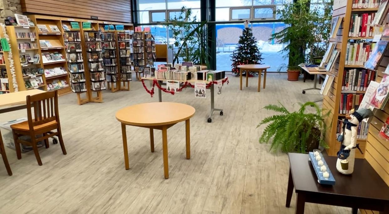 Chairs have been removed inside the public library in Hay River, N.W.T. Staff at the library says it's because too many people have been loitering. (Carla Ulrich/CBC - image credit)