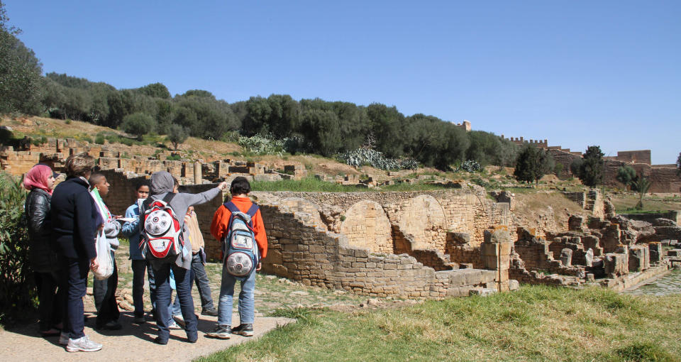 In this March 10, 2012 photo, Moroccan students on a school trip visit the Roman ruins of Sala Colonia outside the capital Rabat. (AP Photo/Paul Schemm)