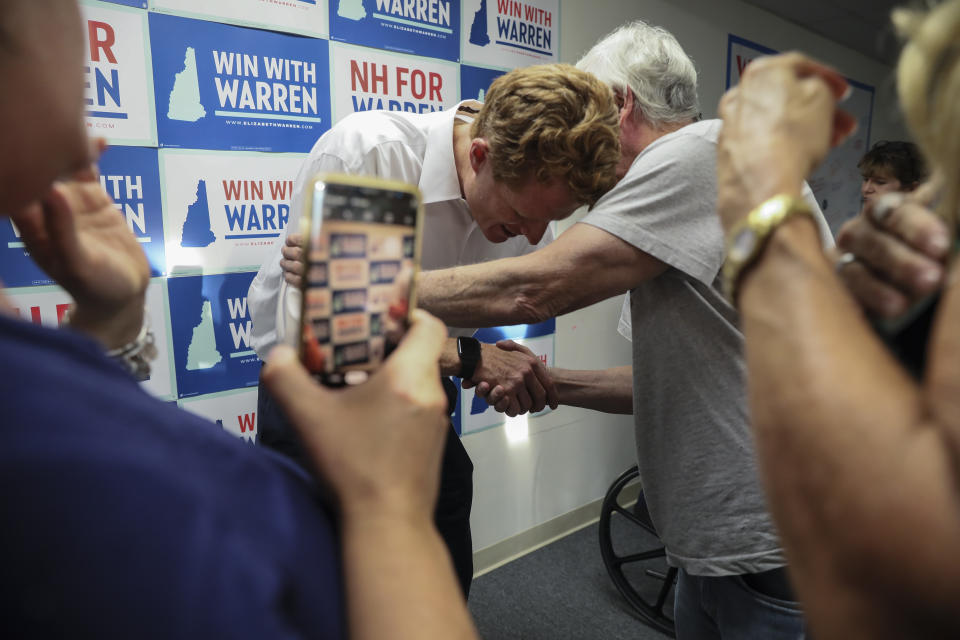 Rep. Joe Kennedy III, D-Mass., talks with volunteer Paul Twomey while campaigning for Democratic presidential candidate Sen. Elizabeth Warren at the New Hampshire for Warren kick off field office opening in Manchester, N.H., Thursday, Sept. 5, 2019: (AP Photo/ Cheryl Senter)