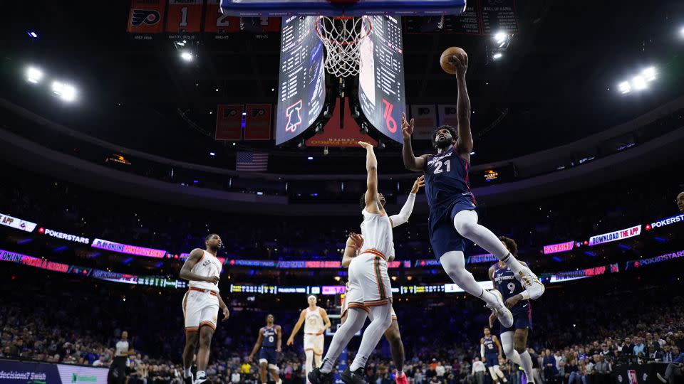 Embiid goes to the basket against the Spurs. - Matt Slocum/AP