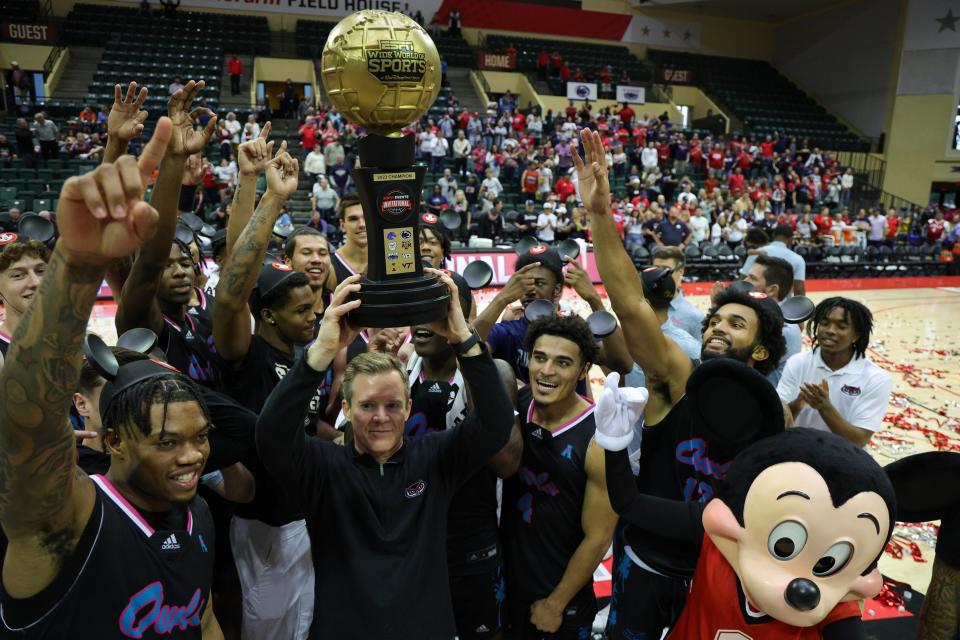 Nov 26, 2023; Kissimmee, FL, USA; Florida Atlantic Owls head coach Dusty May is presented the ESPN Events Invitational Championship trophy after beating the Virginia Tech Hokies at State Farm Field House. Mandatory Credit: Nathan Ray Seebeck-USA TODAY Sports