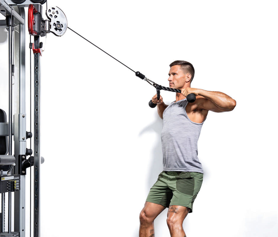 How to do it:<ul><li>Attach a rope handle to the top pulley of a <a href="https://www.mensjournal.com/health-fitness/10-best-cable-exercises-your-core/" rel="nofollow noopener" target="_blank" data-ylk="slk:cable station.;elm:context_link;itc:0;sec:content-canvas" class="link ">cable station.</a></li><li>Grasp an end in each hand with palms facing each other. Step back to place tension on the cable.</li><li>Pull the handles to your forehead so your palms face your ears and your upper back is fully contracted.</li></ul>