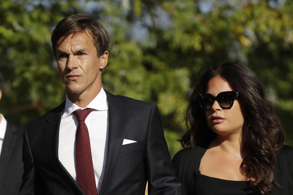 Danish golfer and Ryder Cup winner Thorbjorn Olesen, left, arrives at Isleworth Crown Court in London, Wednesday, Sept. 18, 2019, after being charged with sexual assault, being drunk on an aircraft and common assault. Olesen was arrested on 29 July after returning from the WGC St Jude Invitational on a flight from Nashville to London. Police were waiting for the 29-year-old when the aircraft landed at Heathrow. (AP Photo/Matt Dunham)