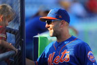 <p>New York Mets bullpen coach Dave Racaniello makes a young fan’s day by giving her a ball in the eighth inning of a baseball game against the Houston Astros at First Data Field in Port St. Lucie, Fla., Feb. 27, 2018. (Photo: Gordon Donovan/Yahoo News) </p>