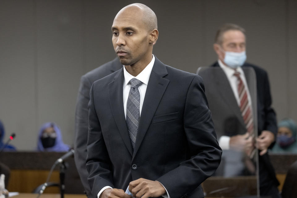 Former officer Mohamed Noor makes his way to the podium to address Judge Kathryn Quaintance at the Hennepin County Government Center, Thursday, Oct. 21, 2021 in Minneapolis. The Minneapolis police officer who fatally shot an unarmed woman after she called 911 to report a possible rape happening behind her home was sentenced Thursday to nearly five years in prison — the most the judge could impose but less than half the 12½ years he was sentenced to for his murder conviction that was overturned last month. (Elizabeth Flores/Star Tribune via AP, Pool)