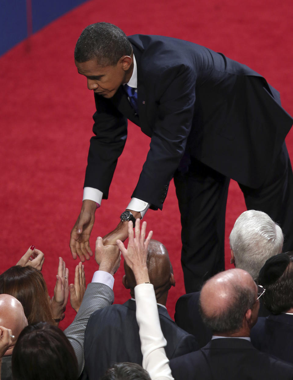 President Barack Obama shakes hands with the audience after the third presidential debate at Lynn University, Monday, Oct. 22, 2012, in Boca Raton, Fla. (AP Photo/Pool-Win McNamee)