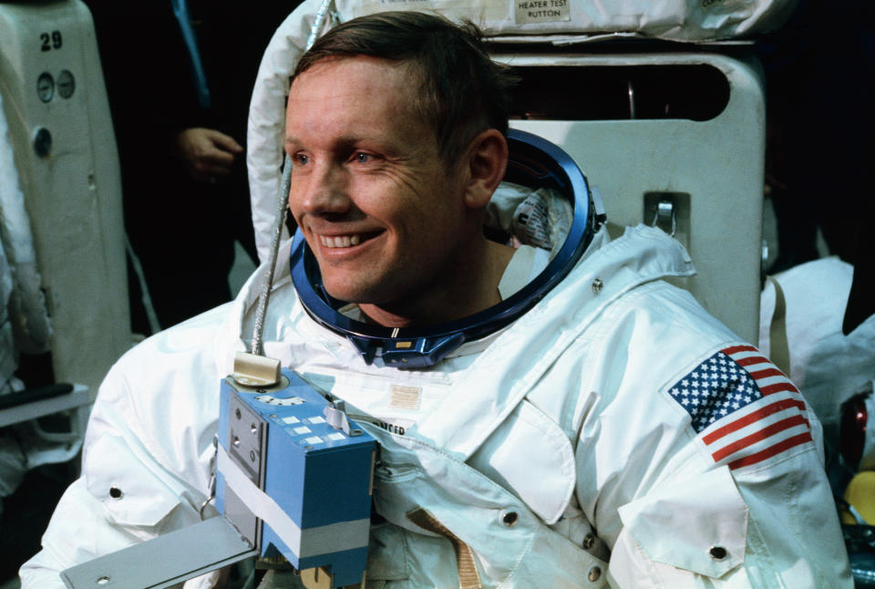 Neil Armstrong in his space suit smiling