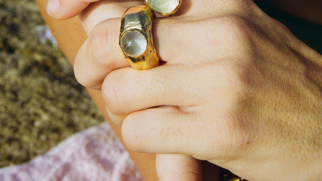 a person holding a pair of rings