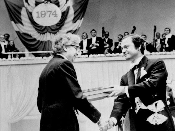 Antony Hewish (left) receives the Nobel prize in 1974, with Bell excluded from the list of recipients (PA)