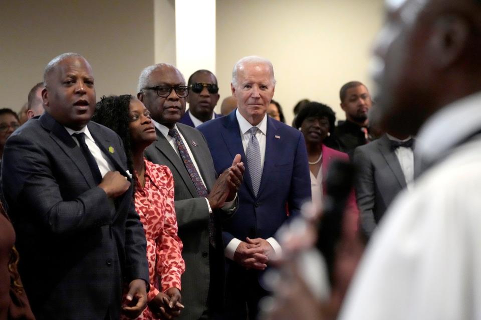President Joe Biden, from right, and Rep. Jim Clyburn, D-S.C., stand among attendees at a service before Biden speaks at St. John Baptist Church, in Columbia, S.C., on Sunday, Jan. 28, 2024. (AP Photo/Jacquelyn Martin)
