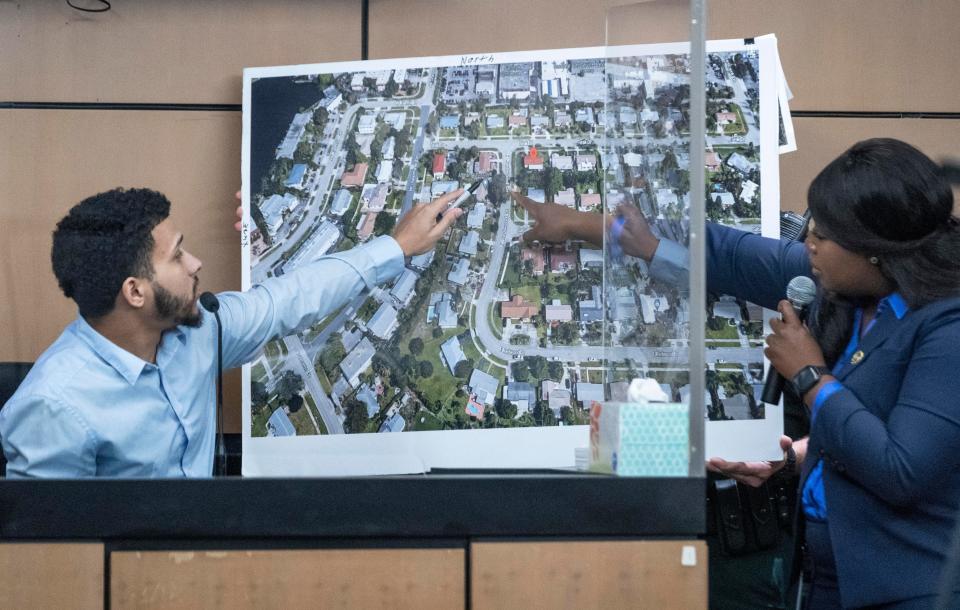 Tyler Robinson, one of four men who confronted Travis Rudolph at his home points at a photo with Assistant State Attorney Francine Edwards during the murder trial of former Florida State University football player Travis Rudolph in West Palm Beach, Florida on May 26, 2023.