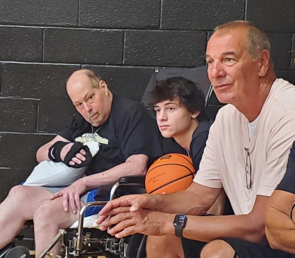 Point Pleasant's Mike Ryan (left), his son, Shane (center) and Mike O'Koren (right) watch the Hudson Catholic basketball team practice in Jersey City on Sept. 11, 2022. Mike Ryan, who died of brain cancer on Nov. 7, 2022, and O'Koren both starred at Hudson Catholic.