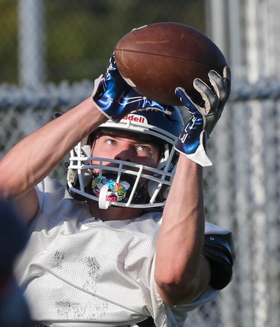 Walton WR Dalton Kolmetz makes a catch during a football practice at Walton High School.