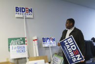 Daniel Henry poses at the campaign headquarters for the Duval County Democratic Party in Jacksonville, Fla., on Thursday, Oct. 22, 2020. Henry is the youngest chair of a major county political party in Florida. (AP Photo/Bobby Caina Calvan)