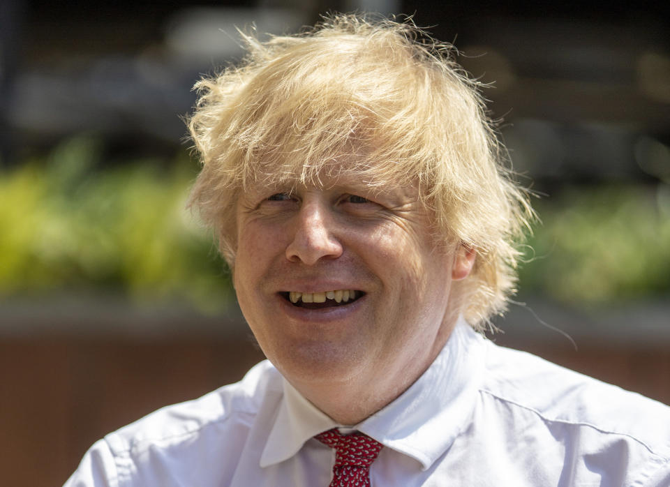 LONDON, ENGLAND - JUNE 26: British Prime Minister Boris Johnson during a visit to Pizza Pilgrims in West India Quay, London Docklands, as they prepare to reopen as lockdown rules are eased on July 4th, on June 26, 2020 in London, England. (Photo by Heathcliff O'Malley - WPA Pool/Getty Images)