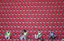 Substitute player of Bayern Munich are seen during the German Bundesliga soccer match between Union Berlin and Bayern Munich in Berlin, Germany, Sunday, May 17, 2020. The German Bundesliga becomes the world's first major soccer league to resume after a two-month suspension because of the coronavirus pandemic. (AP Photo/Hannibal Hanschke, Pool)