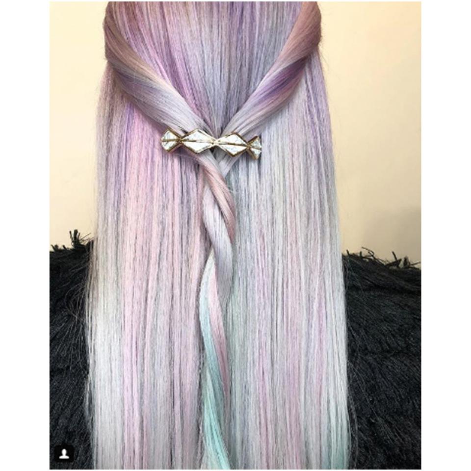 San Francisco-based colorist Rachel Stefanik created this prominently lavender pastel version of the hair trend. We love the contrasting touches of blue and green in this one. The twisted style and hair accessory are giving us <a rel="nofollow noopener" href="https://www.allure.com/story/game-of-thrones-hair-instagram?mbid=synd_yahoo_rss" target="_blank" data-ylk="slk:Khaleesi;elm:context_link;itc:0" class="link ">Khaleesi</a> weekend vibes.