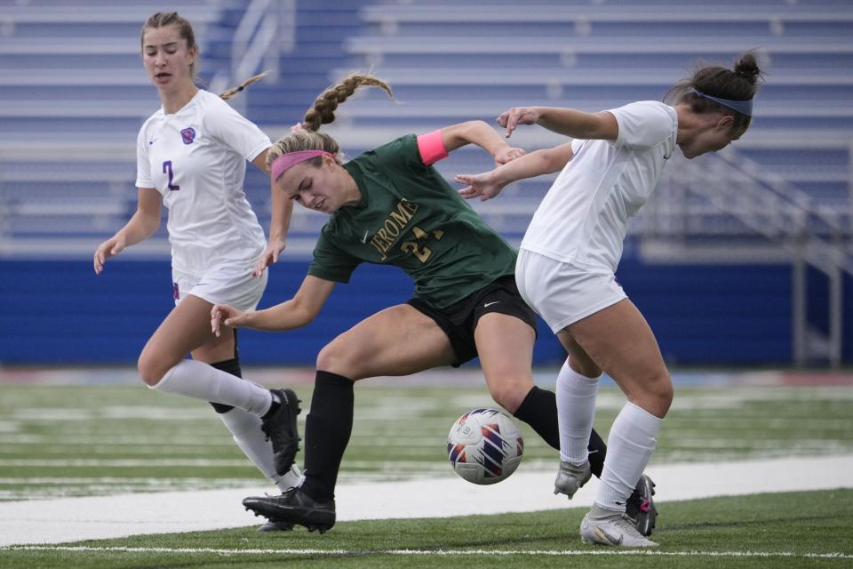 Dublin Jerome’s Sophia Penegor (center) battles Olentangy Orange’s Bella Leonetti (left) and Maryn Zavislak during the Division I regional final Nov. 5 at Marysville. Orange won 1-0.