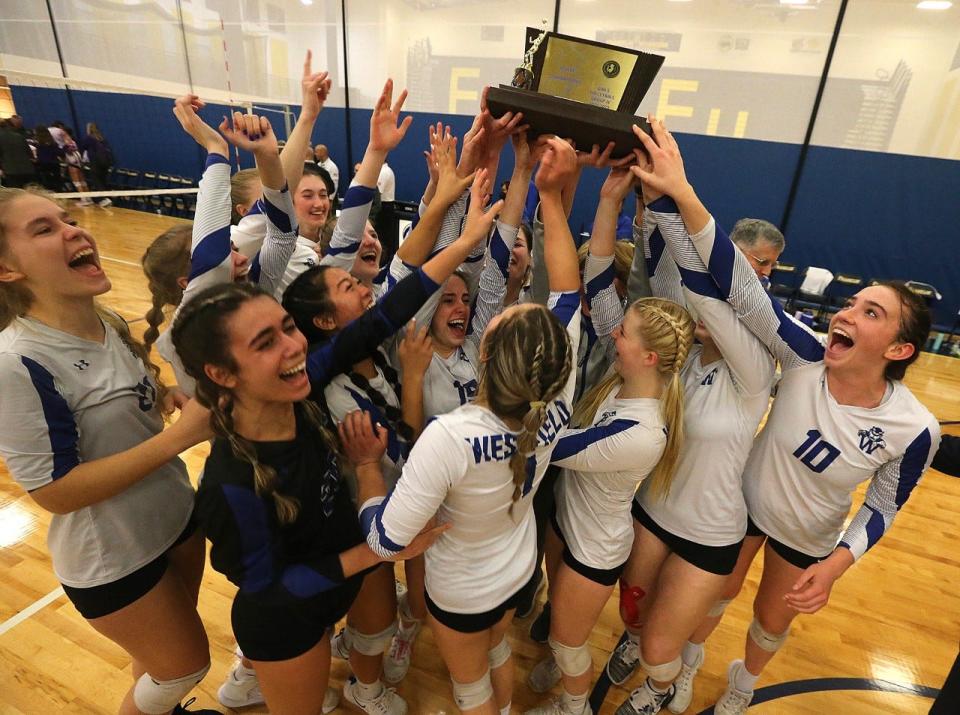 The Westfield girls volleyball team celebrates after winning the Group 4 championship on Nov. 13, 2022