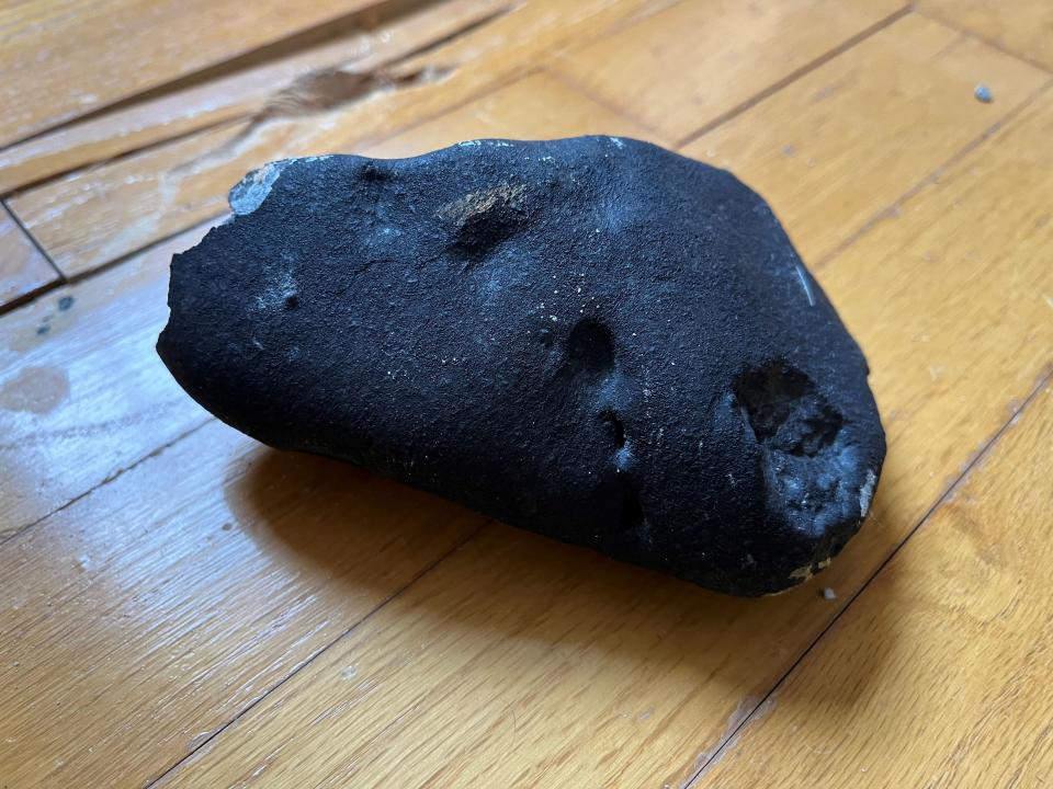 a black rock on a table