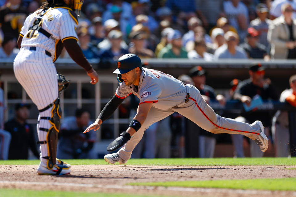 SAN DIEGO, CALIFORNIA - MARCH 28: Michael Conforto #8 of the San Francisco Giants scores on an RBI sacrifice fly by Jung Hoo Lee #51 in the seventh inning during an Opening Day game against the San Diego Padres at PETCO Park on March 28, 2024 in San Diego, California. (Photo by Brandon Sloter/Getty Images)