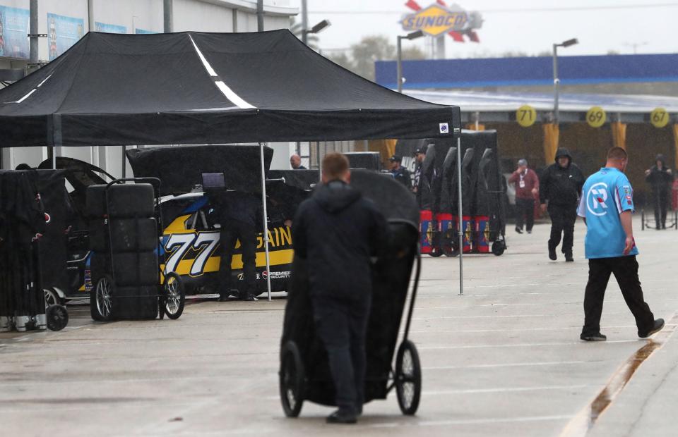 Garage work continues at Daytona as a light rain comes and goes.